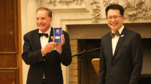 Dr Brenden Tempest-Mogg receiving a recognition award